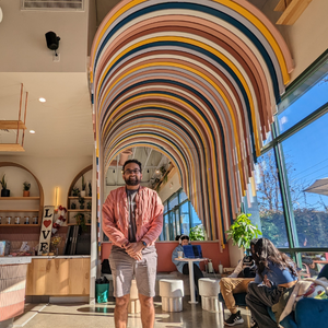 Voyager Coffee owner Sameer Shah standing in the Voyager Cupertino Location. 