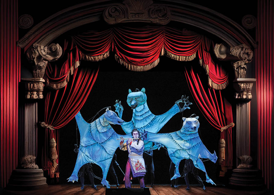  a stage with a red curtain and a wooden floor with a statue on it's side and a wooden floor. . 